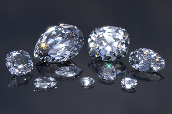 Nine main biggest Cullinan diamonds with reflections on black mirror background. British crown jewels, Cullinan I Great Star of Africa and others. Close-up view. 3D rendering illustration