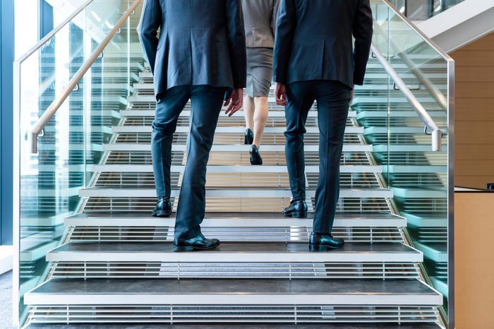 Business persons going up the stairs.