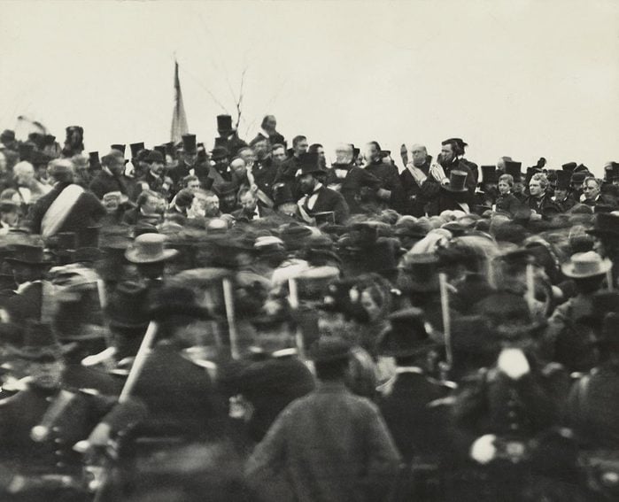 VARIOUS U.S. President Abraham Lincoln (without Hat below Flag slightly right) Standing Amongst Crowd during Dedication of Soldier's National Cemetery where he Delivered his Famous Speech, the Gettysburg Address, Gettysburg, Pennsylvania, USA, November 19, 1863