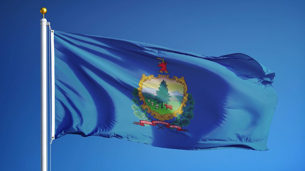 Vermont (U.S. state) flag waving against clear blue sky, close up, isolated with clipping path mask alpha channel transparency, perfect for film, news, composition
