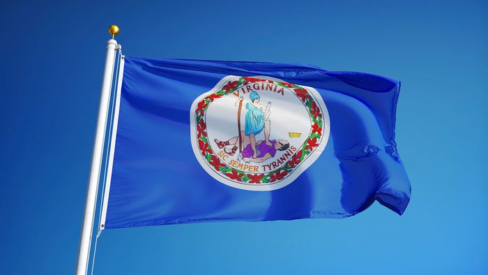 Virginia (U.S. state) flag waving against clear blue sky, close up, isolated with clipping path mask alpha channel transparency, perfect for film, news, composition