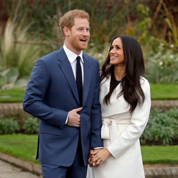 Britain's Prince Harry and his fiancee Meghan Markle pose for photographers during a photocall in the grounds of Kensington Palace in London