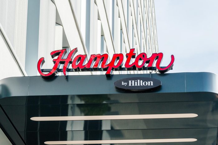 Berlin, Germany - August 18, 2018: The Hampton by Hilton logo and sign.
