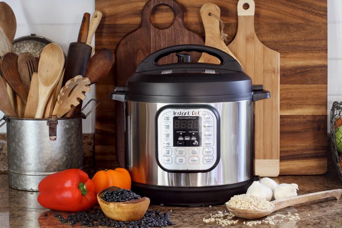 Breeding, KY, USA - January 08, 2019: Instant Pot pressure cooker on kitchen counter with beans and rice.