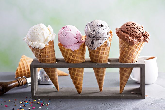 Variety of frozen custard or ice cream scoops in cones