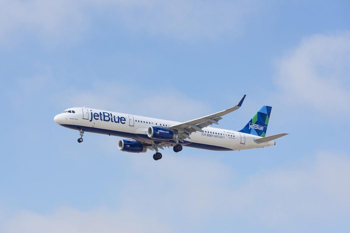 LOS ANGELES, CA/USA - JUNE 15, 2015: 'Memta Fresca' Jet Blue aircraft (Airbus A321, reg N942JB) in flight shortly before landing at the Los Angeles World Airport (LAX). 'Our 200th Aircraft' livery.