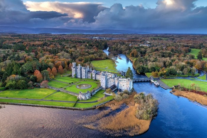 Luxury Ashford castle and gardens from above drone- Co. Mayo - Ireland
