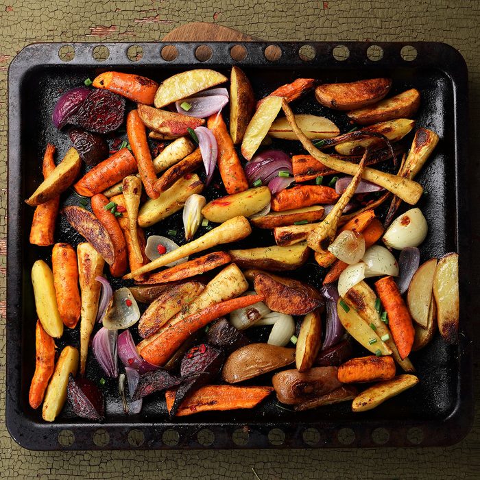 Roasted vegetables mix on baking tray, food above