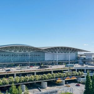 San Francisco, California, USA - January 21, 2019 : Exterior view of International terminal of San Francisco International Airport. Cars, buses and shuttles pick up and drop off passengers.