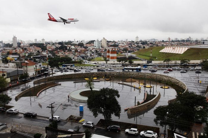 Sao Paulo, SP / Brazil - July 17, 2012: A plane of Brazil's TAM airline arrives in Congonhas airport past the site of the tragedy where an aircraft of TAM crashed and burst into flames in July17 2007.