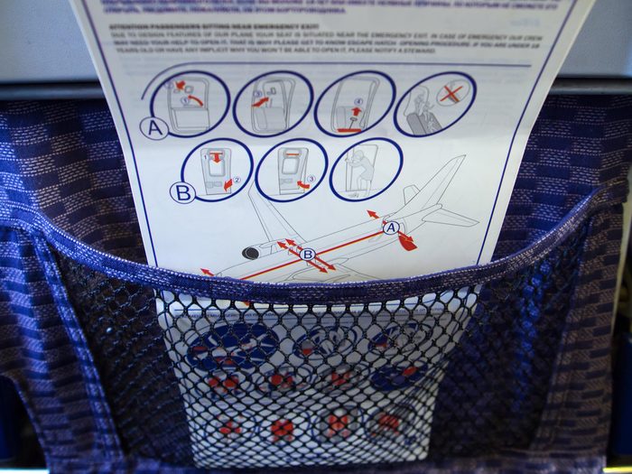 Safety instructions in the pocket of an airplane chair