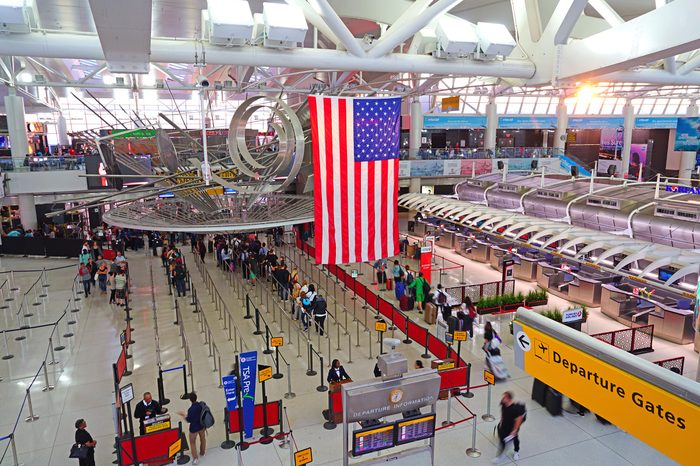 NEW YORK, NY -9 AUG 2017- View of a giant American flag inside Terminal 1 at the John F. Kennedy International Airport (JFK).