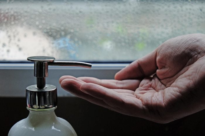 men hand waiting for lotion in raining day, men skin care concept