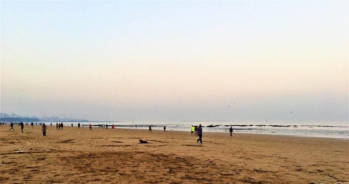 Early Morning view of Juhu Beach with unidentified morning walkers as on 1st April 2018.