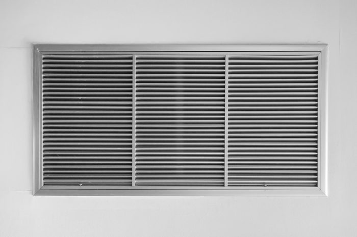 air ventilator ,metal slat frame on white wall background