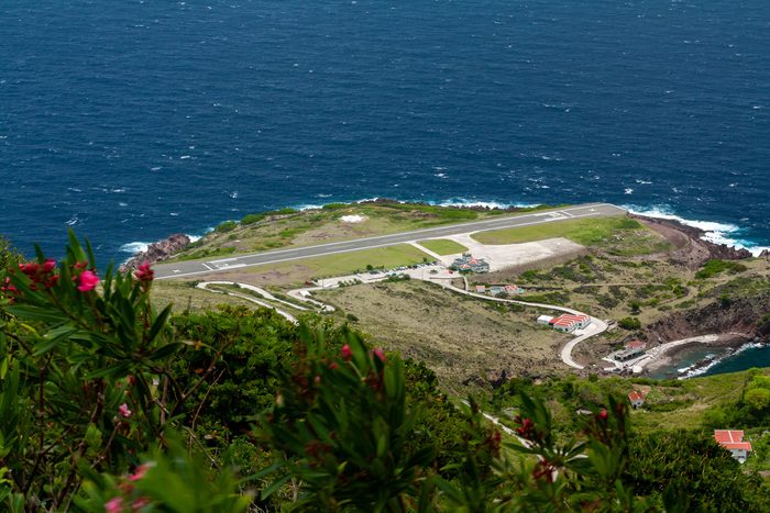 Airport, on island of Saba in Caribbean area, has one of the shortest runways in the world, only 400 metres long. Flanked on one side by high hills, with cliffs that drop into the sea at both ends.