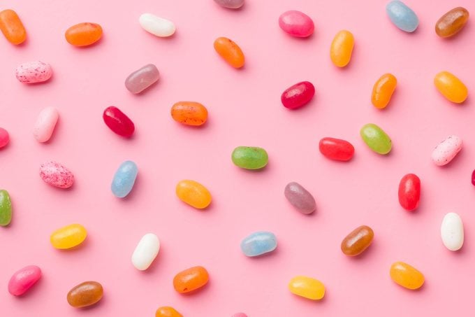 Sweet jelly beans on pink background