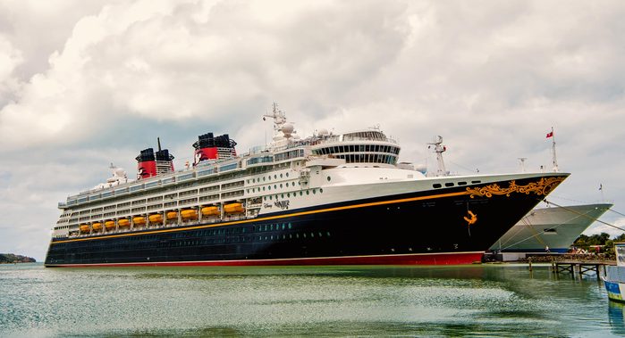 Nassau, Bahamas-January 15, 2016: Large luxury cruise ship Disney Wonder on sea water and cloudy sky background docked at port of Nassau, Bahamas