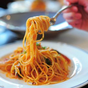 Spaghetti with tomato sauce close up