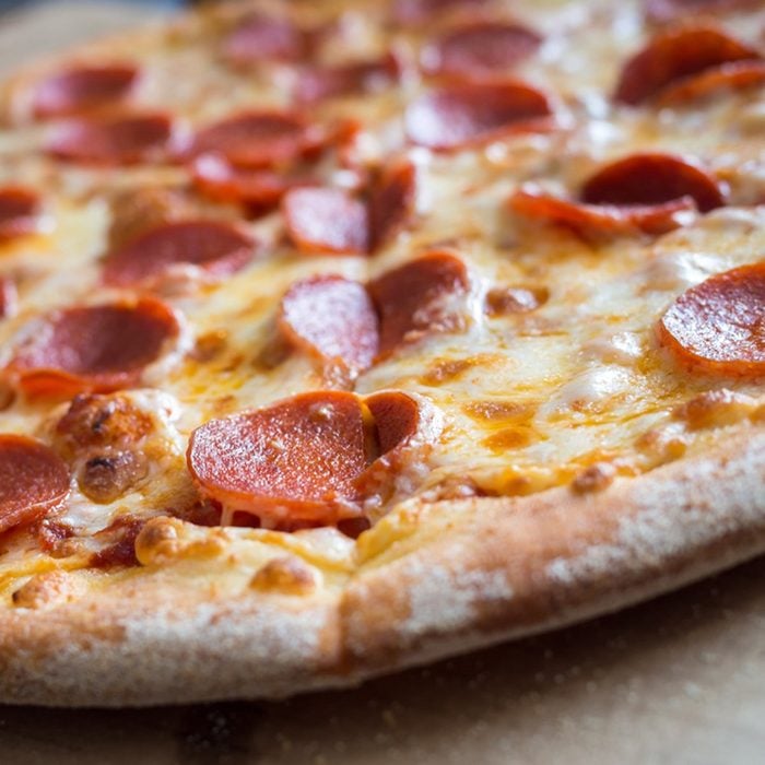 Fresh baked pepperoni pizza, shallow depth of field; Shutterstock ID 522293875