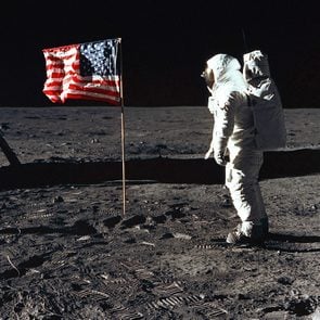 Astronaut Edwin 'Buzz' Aldrin, lunar module pilot of the first lunar landing mission, poses for a photograph beside the U.S. flag during the Apollo 11 mission