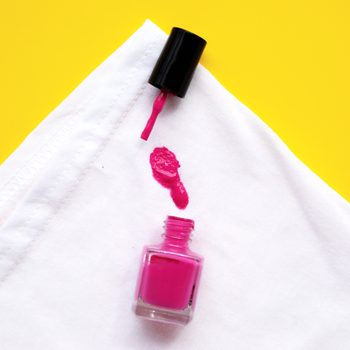 pink nail polish stained on white cloth
