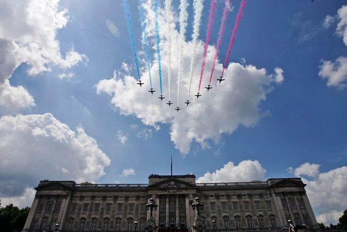 British Royal Air Force Red Arrows jets fly past over Buckingham Palace in central London