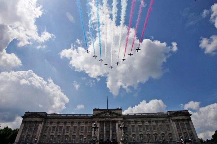 British Royal Air Force Red Arrows jets fly past over Buckingham Palace in central London