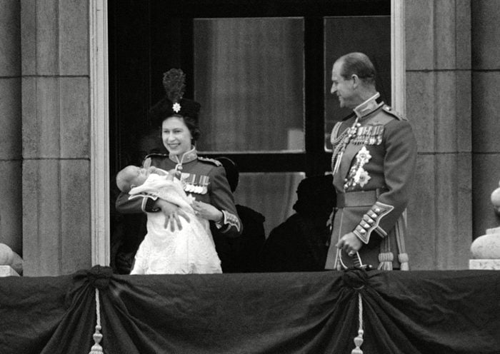 Queen Elizabeth II holds up 12-week-old son Prince Edward
