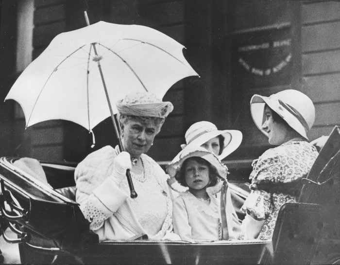 Queen Mary drives in her carriage with the duchess of York
