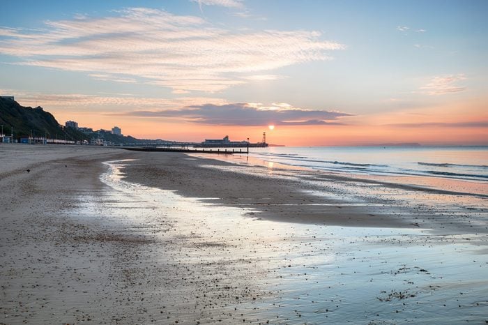 Sunrise over Bournemouth beach with the pier in the distance