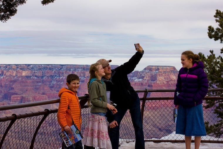 family in grand canyon selfie