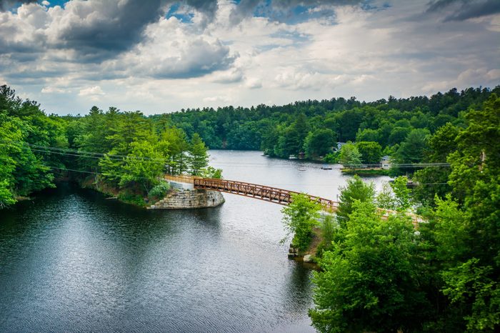View of wooden bridge over the Piscataquog River, from the Pinard Street Bridge in Manchester, New Hampshire.