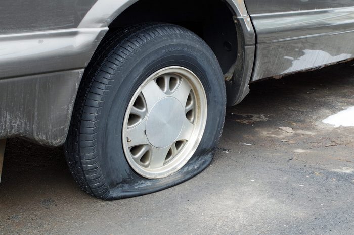 Flat rear tire on car