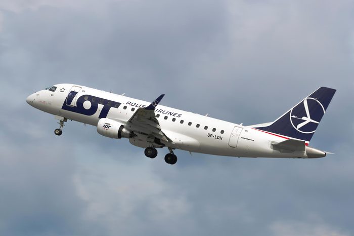GDANSK, POLAND - SEPTEMBER 4, 2018: Polish Airlines PLL LOT branded Embraer 170 airplane flying from Lech Walesa International Airport in Gdansk in cloudy sky.