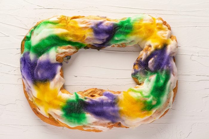 a whole king cake overhead view, a tradition in New Orleans for Mardi Gras