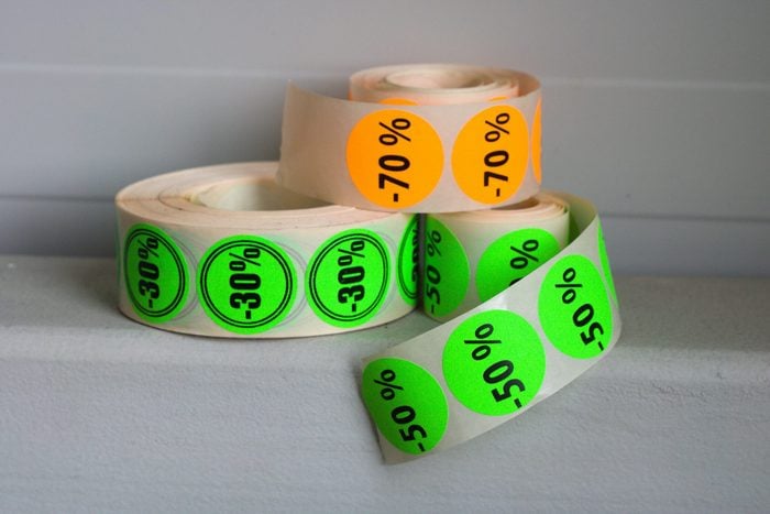 Printed colorfull sticker rolls on gray background.