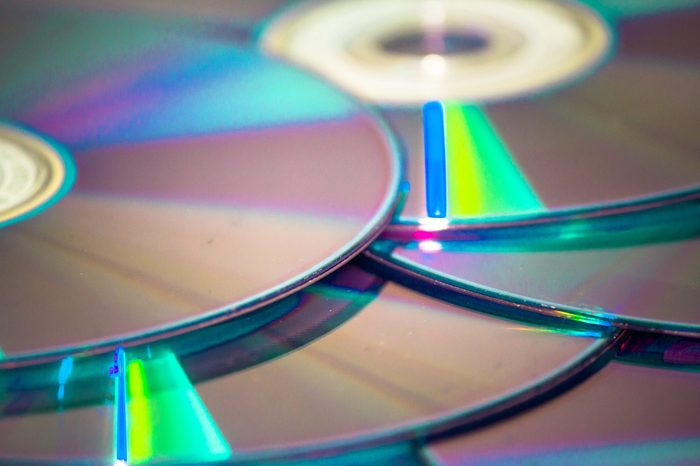 bunch of DVDs spread, blured background