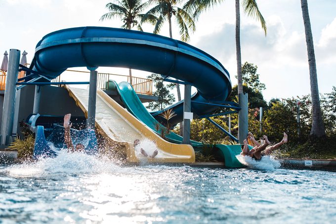 People coming down from a water slide