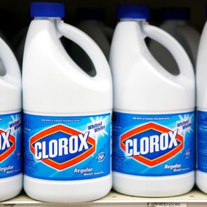 bottles of Clorox on a shelf in a grocery store