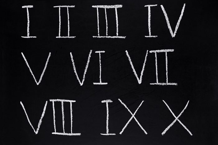 Roman numerals 1 to 10 written on a blackboard.