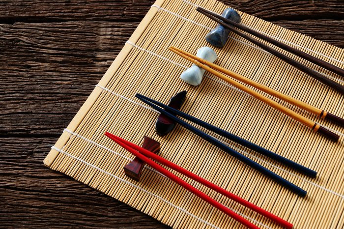 chopsticks on bamboo mat background.Flat lay,Copy space