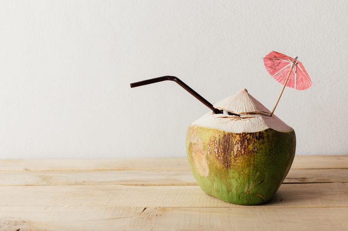 coconut on wooden floor with white background