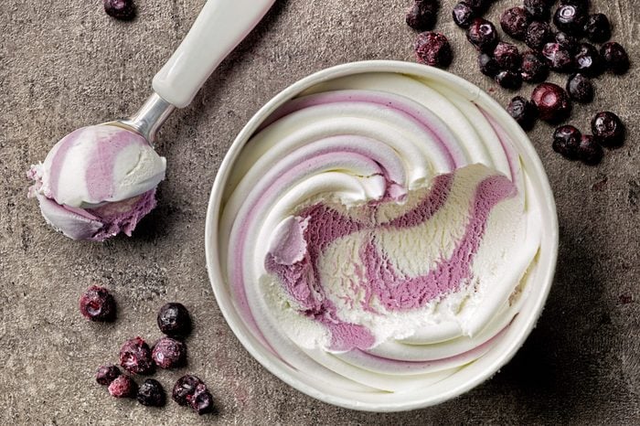 vanilla and blueberry ice cream on gray table, top view
