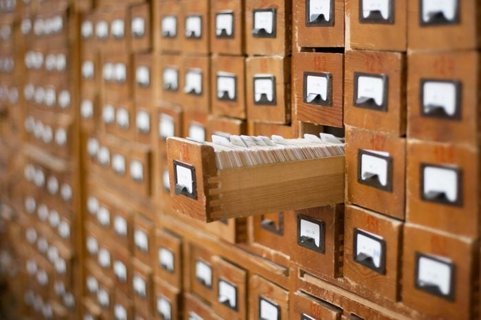 Old wooden card catalogue with one opened drawer