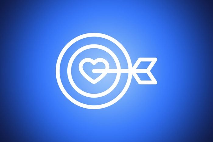 icon of arrow hitting a heart shaped bullseye on blue background