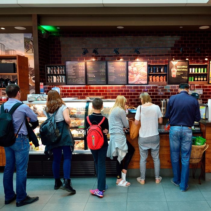 People standing in line in a Starbucks