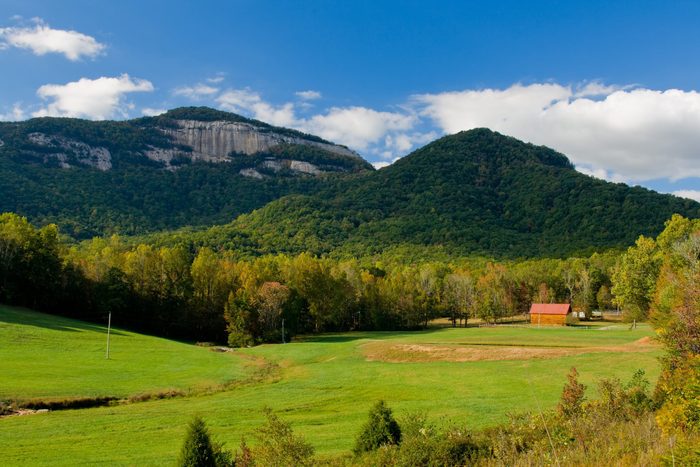 table rock mountain fall scenic with mountain meadow and distant peak