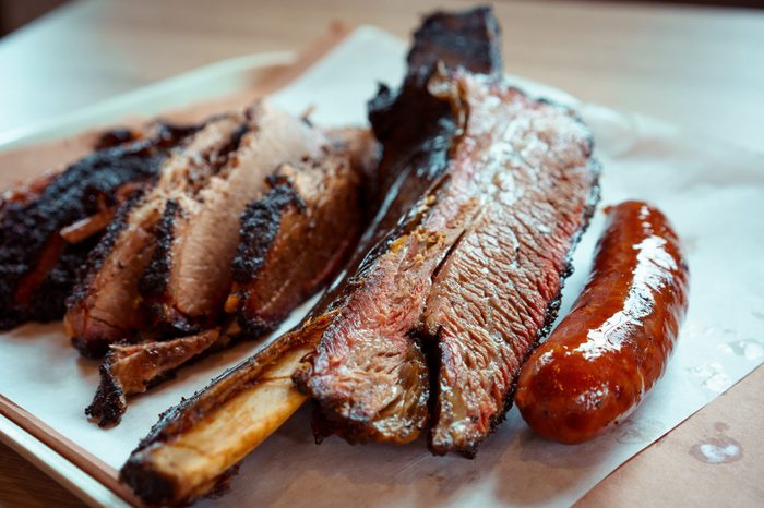 texas bbq style tray with rib brisket and sausage