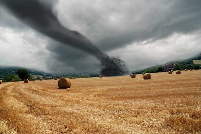 twister on countryside with dark sky
